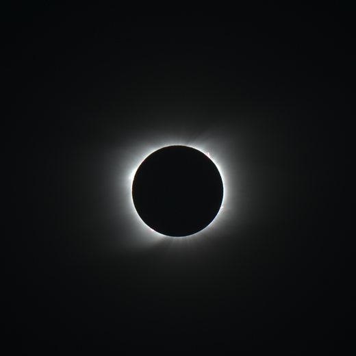 Eclipse frame at 1/80 s: the inner corona beginning to show around the disk.